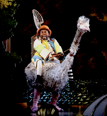 Will Liverman as Papageno riding an ostrich in The Magic Flute at Santa Fe Opera, 2026.